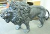 Pair bronze life size male lions with full manes (one tail repaired)