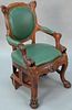 Victorian oak armchair with faces and large paw feet which transforms to library stairs with green leather upholstery. ht. 38