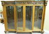 Oak bookcase/china cabinet, top with band of horse and scroll carving over four doors, two center doors, bowed glass, all fla
