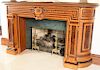 Aesthetic movement fireplace mantle, birdseye maple, rosewood, and burl walnut with center urn and Greek key inlay flanked by