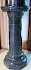 Green granite pedestal with round top on octagon foot.  ht. 33in.  Provenance: Property from the Estate of Frank Perrotti Jr.