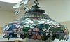 Large leaded stained glass hanging lamp, bell form shade with colorful flower and leaf design and four sockets, possibly Duff