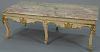 Louis XV style coffee table with rouge marble top, set on carved frieze on six cabriole legs in white with gilt highlights