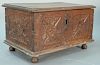 Continental walnut lift top box with floral carved front and sides, set on turned legs, 18th century. ht. 10in., top: 11 1/4"