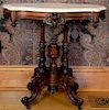 Rosewood turtle marble top table on four turned supports and scrolled feet. ht. 29in., top: 20" x 29" Provenance: Property fr