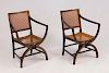 PAIR OF REGENCY STYLE CANED, EBONIZED AND PARCEL-GILT ARMCHAIRS