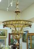 Bronze hanging light, circular form with two levels plus center drop, forty-eight total lights. ht. 71in., dia. 43in.  Proven