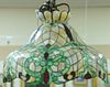 Victorian leaded glass hanging light, bell shaped with caramel, green, and red glass. ht. 24in. (includes chain), dia. 25in.