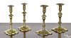 Two pairs of Queen Anne brass candlesticks