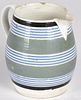 Mocha pitcher with blue, teal, and black bands