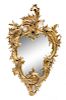 * A Rococo Style Giltwood Mirror Height 32 1/2 x width 19 3/4 inches.