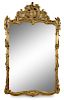 A Large Louis XV Style Giltwood Mirror Height 104 x width 62 1/2 inches.