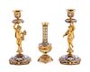 * A Pair of Champleve Decorated Gilt Bronze Figural Candlesticks Height of candlestick 8 inches.