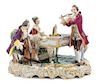 A German Porcelain Figural Group Height 10 1/4 x width 13 inches.
