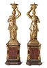 A Pair of Painted and Parcel Gilt Figural Stands Height 66 5/8 inches.