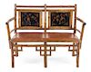 An English Lacquered Bamboo Settee Height 37 inches.