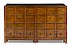 A Chinese Elmwood Apothecary Chest Height 38 x width 63 x depth 17 1/2 inches.