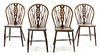 A Set of Four Oak Windsor Chairs Height 33 3/4 inches.
