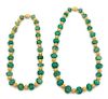 Two Carved Green and Gold Beaded Necklaces Length of longest 26 inches.