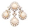 A Faux Pearl and Cubic Zirconia Goldtone Brooch with Three Pendants Width 2 1/4 inches.
