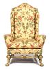 A Spanish Baroque Style Giltwood Wing Chair Height 56 inches.