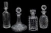 A Group of Four Crystal Decanters Height of tallest 9 1/2 inches.