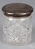 Brilliant cut glass canister, early 20th c., with a sterling silver lid, 6 1/2'' h.