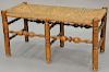 Primitive style bench with rush seat and turned legs and stretchers in the manner of Wallace Nutting. ht. 19in., top: 18" x 3