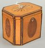 Federal inlaid tea caddy having oval fan inlaid top with oval inlaid panel sides and banded inlaid edges. ht. 5in., wd. 5 1/2