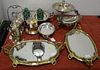 Group lot to include silverplate tea pot, two biscuit jars, figural compote, and two bureau plats with brass frame. Provenanc