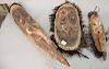 Group of three African masks with horns and inlaid shells. ht. 20in., 20 1/2in., & 34in.