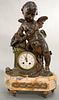 Victorian cast metal figural clock with winged putti figure and birds over clock on marble base. ht. 21in., wd. 12in. Provena