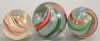 Three large antique swirl marbles, two with latticino swirl. dia. 1 3/4in., 11 3/4in. Provenance: Property from the Estate of