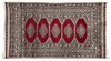 An Indo-Bokhara Wool Rug 5 feet 6 1/4 inches x 3 feet 1 inch.