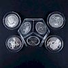 Collection of Seven (7) Sterling Silver Medals in Plastic Display