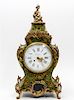 * A Louis XV Style Gilt Metal Mounted Painted Mantel Clock Height 21 inches.