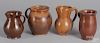 Four redware pitchers, 19th c.
