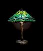 A Tiffany Studios Favrile Glass and Bronze Dragonfly Table Lamp, Diameter of shade 20 x height overall 25 3/4 inches.
