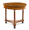 An Empire Style Fruitwood Gueridon Height 32 x diameter of top 34 1/4 inches.