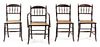 A Set of Four Victorian Turned Oak Game Chairs Height 32 1/2 inches.