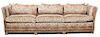 A Knole Style Leopard Print Upholstered Sofa Height 30 x width 105 inches.
