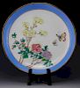 A Chinese Enamel plate depicting floral and butterflies