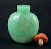Jadeite snuffle bottle with red coral stopper from Qing
