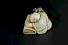 Vintage Netsuke carving of a scholar sleeping with a