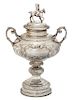 An English Silver Polo Two-Handle Trophy Cup, Mappin & Webb, Sheffield, 1900, the lid having a polo player on pony; raised on