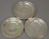 Three sterling round trays. dia. 11in., 9 1/2in., & 9 1/2in., 26.6 t oz.
