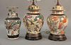 Three piece lot to include a pair of rose medallion table lamps and one vase (one lamp with large chip). vase ht. 14in.