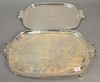 Two large silver plated trays having scroll handles. lg. 22 1/2in. and 24 3/4in.