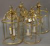 Set of four brass and glass two light hanging lights. ht. 18 1/2in.
