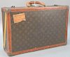 Louis Vuitton suitcase with label inside Louis Vuitton, initialed MDH 79545. ht. 5 3/4in., wd. 20in., dp. 13in.